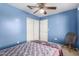 Simple bedroom with ceiling fan and window blinds at 553 S Meadows Dr, Chandler, AZ 85224