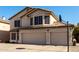 Two-story house with three-car garage, basketball hoop, and front yard at 553 S Meadows Dr, Chandler, AZ 85224