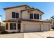 Two-story house with three-car garage and landscaped front yard at 553 S Meadows Dr, Chandler, AZ 85224