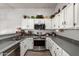 Modern kitchen with white cabinets and gray countertops at 553 S Meadows Dr, Chandler, AZ 85224