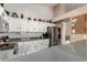 Modern kitchen with white cabinets and gray countertops at 553 S Meadows Dr, Chandler, AZ 85224