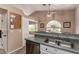 Kitchen features a double sink, dishwasher, and an arched window at 553 S Meadows Dr, Chandler, AZ 85224