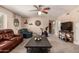 Living area with leather sofas, exercise bike, and coffee table at 553 S Meadows Dr, Chandler, AZ 85224