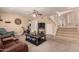 Relaxing living room with leather furniture and a large TV at 553 S Meadows Dr, Chandler, AZ 85224