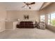 Bright living room with large windows and comfortable seating at 553 S Meadows Dr, Chandler, AZ 85224