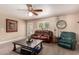 Spacious living room with leather furniture and coffee table at 553 S Meadows Dr, Chandler, AZ 85224