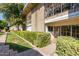 Condominium building exterior with walkway and landscaping at 6125 E Indian School Rd # 180, Scottsdale, AZ 85251