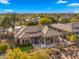 Aerial view of home showcasing backyard patio, lawn, and mountain views at 6358 E Evening Glow Dr, Scottsdale, AZ 85266