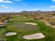 Aerial view of community golf course with mountain views at 6358 E Evening Glow Dr, Scottsdale, AZ 85266