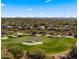 Aerial view of community with golf course and mountain backdrop at 6358 E Evening Glow Dr, Scottsdale, AZ 85266