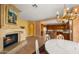 Bright dining area with fireplace and kitchen view at 6358 E Evening Glow Dr, Scottsdale, AZ 85266