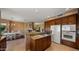 Island kitchen with granite countertops and stainless steel appliances at 6358 E Evening Glow Dr, Scottsdale, AZ 85266