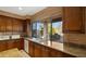 Kitchen features granite counters and a large window at 6358 E Evening Glow Dr, Scottsdale, AZ 85266