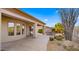 Covered patio with seating area, desert landscaping, and built-in grill at 6358 E Evening Glow Dr, Scottsdale, AZ 85266