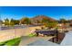 Landscaped backyard with a pergola, shade sails, and mountain views at 6414 W Villa Linda Dr, Glendale, AZ 85310