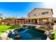 Stunning backyard with a pool and pergola, offering scenic views at 6414 W Villa Linda Dr, Glendale, AZ 85310