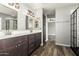 Bathroom with double vanity and large walk-in shower at 6414 W Villa Linda Dr, Glendale, AZ 85310