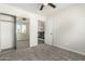 Bedroom with mirrored closet and access to loft area at 6414 W Villa Linda Dr, Glendale, AZ 85310