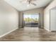 Bedroom with wood floors and sliding glass doors to balcony at 6414 W Villa Linda Dr, Glendale, AZ 85310