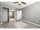 Bedroom with mirrored closet and carpet flooring at 6414 W Villa Linda Dr, Glendale, AZ 85310