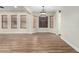 Bright dining room featuring hardwood floors and large windows at 6414 W Villa Linda Dr, Glendale, AZ 85310