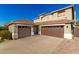 Two-story house with two-car garage and desert landscaping at 6414 W Villa Linda Dr, Glendale, AZ 85310