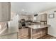 Modern kitchen with light cabinets, stainless steel appliances, and an island at 6414 W Villa Linda Dr, Glendale, AZ 85310