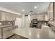 Modern kitchen with light cabinets, stainless steel appliances and an island at 6414 W Villa Linda Dr, Glendale, AZ 85310