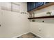 Clean laundry room with built-in shelving and cabinets at 6414 W Villa Linda Dr, Glendale, AZ 85310