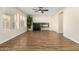 Living room with hardwood floors, fireplace and large windows at 6414 W Villa Linda Dr, Glendale, AZ 85310