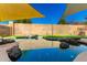 Refreshing pool with rock features and shade sails at 6414 W Villa Linda Dr, Glendale, AZ 85310