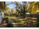 Large backyard with playset, trampoline, and grassy area at 6740 N 7Th St, Phoenix, AZ 85014