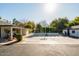 Large backyard basketball court with surrounding hedges at 6740 N 7Th St, Phoenix, AZ 85014