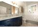 Stylish bathroom with double vanity, subway tile, and marble floors at 6740 N 7Th St, Phoenix, AZ 85014