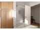 Modern bathroom with walk-in shower, subway tile and light wood cabinets at 6740 N 7Th St, Phoenix, AZ 85014