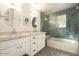 Bright bathroom with double vanity, hexagonal tile, and a bathtub at 6740 N 7Th St, Phoenix, AZ 85014