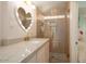 Elegant bathroom with heart shaped mirror, pink tile and a walk-in shower at 6740 N 7Th St, Phoenix, AZ 85014