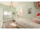 Pastel bedroom with a twin bed, dresser, and access to a bathroom at 6740 N 7Th St, Phoenix, AZ 85014