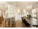 Bright dining room featuring a long wooden table and chandelier at 6740 N 7Th St, Phoenix, AZ 85014