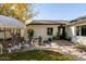 Inviting front patio with seating and umbrella at 6740 N 7Th St, Phoenix, AZ 85014