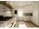 Modern kitchen with white cabinets and a range at 6740 N 7Th St, Phoenix, AZ 85014