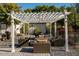 Relaxing patio with pergola, fire pit, and comfortable seating at 6740 N 7Th St, Phoenix, AZ 85014