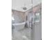 Elegant bathroom with soaking tub, walk-in shower, and marble tile at 7258 E Manzanita Dr, Scottsdale, AZ 85258