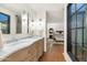 Double vanity bathroom with view into the bedroom at 7258 E Manzanita Dr, Scottsdale, AZ 85258