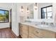 Bathroom with double vanity, marble countertops, and updated fixtures at 7258 E Manzanita Dr, Scottsdale, AZ 85258