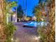 Inviting pool and patio area with lush landscaping at 7258 E Manzanita Dr, Scottsdale, AZ 85258