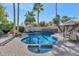 Stunning kidney-shaped pool with spa and brick patio at 7258 E Manzanita Dr, Scottsdale, AZ 85258