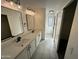 Double vanity bathroom with modern finishes at 7827 W Cypress St, Phoenix, AZ 85035