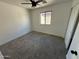 Simple bedroom with ceiling fan and carpet at 7827 W Cypress St, Phoenix, AZ 85035