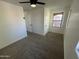 Spacious bedroom with ceiling fan and carpet at 7827 W Cypress St, Phoenix, AZ 85035